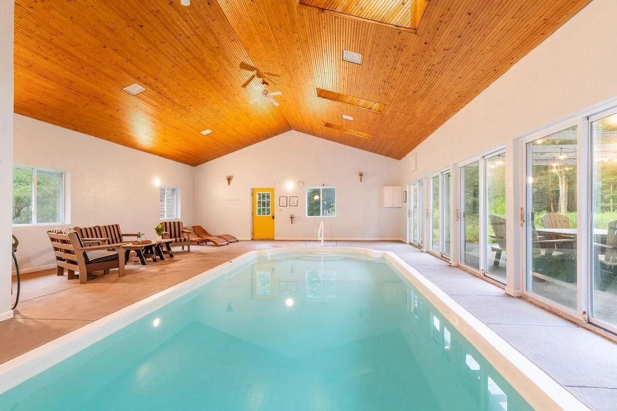 Image may contain Indoors Interior Design Pool Water Swimming Pool Chair Furniture Floor Art Painting and Outdoors