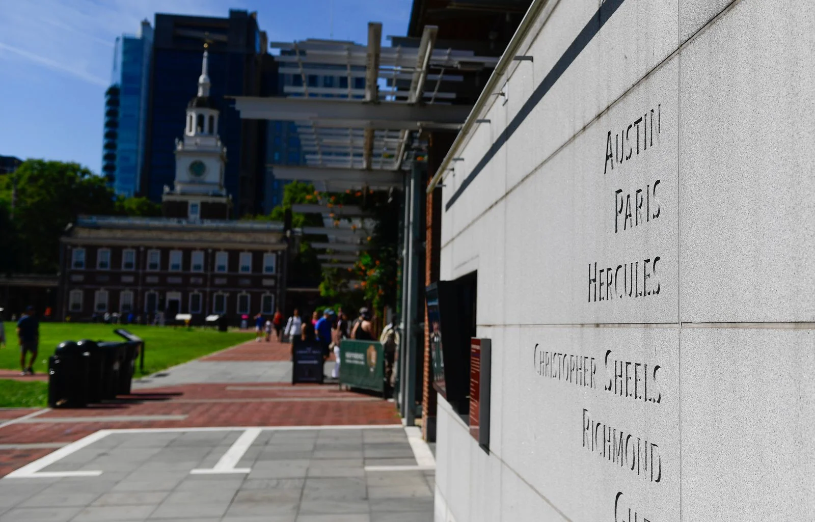 Image may contain City Road Street Urban Path Sidewalk Architecture Building Walkway Alley and Person