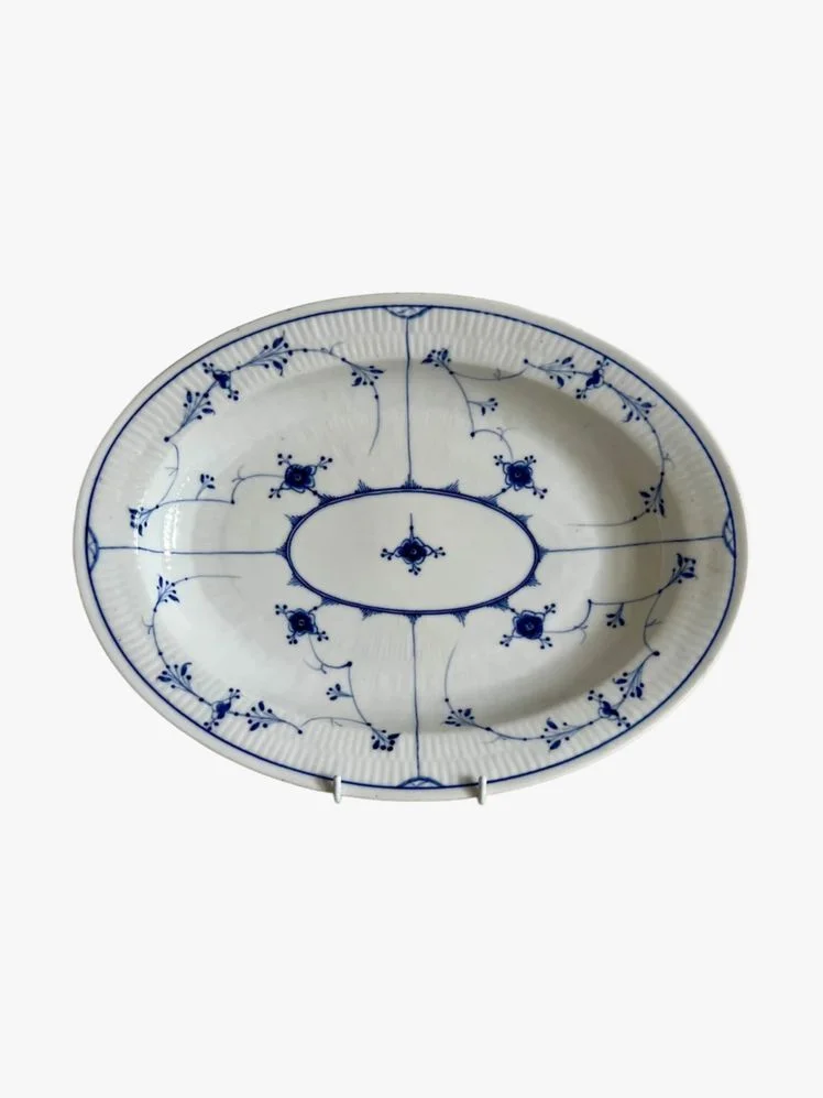 Image may contain: Art, Porcelain, Pottery, Food, Meal, Plate, and Dish