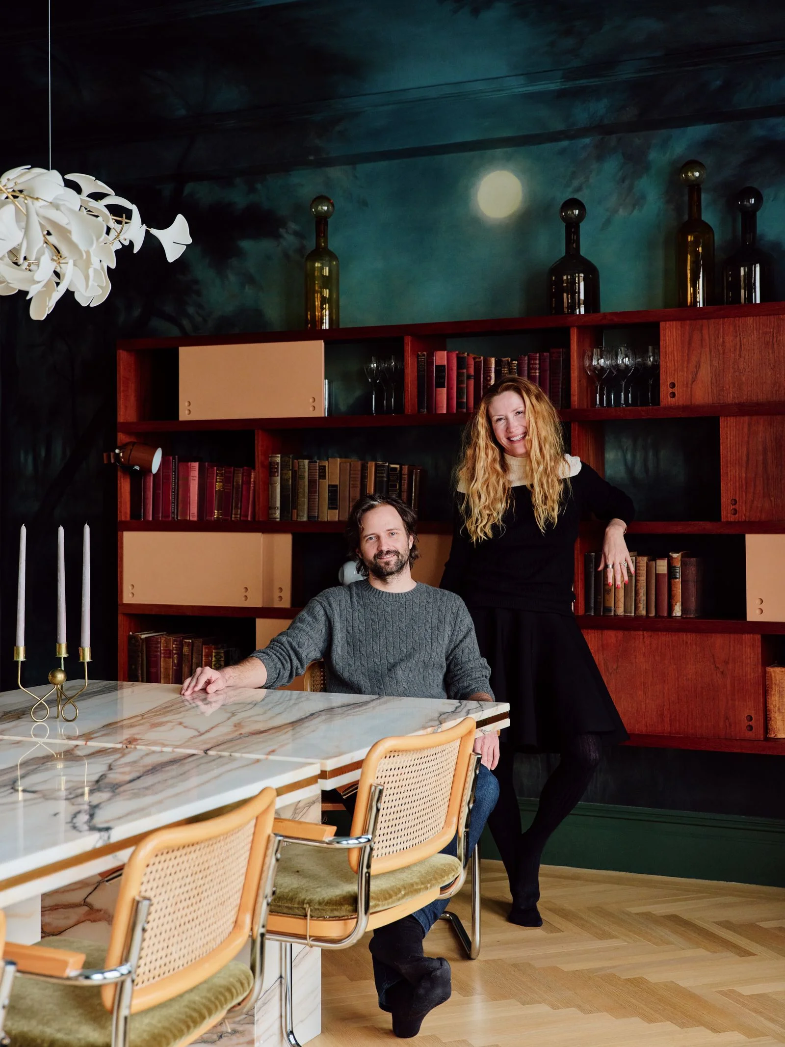 Image may contain Architecture Building Dining Room Dining Table Furniture Indoors Room Table Adult and Person