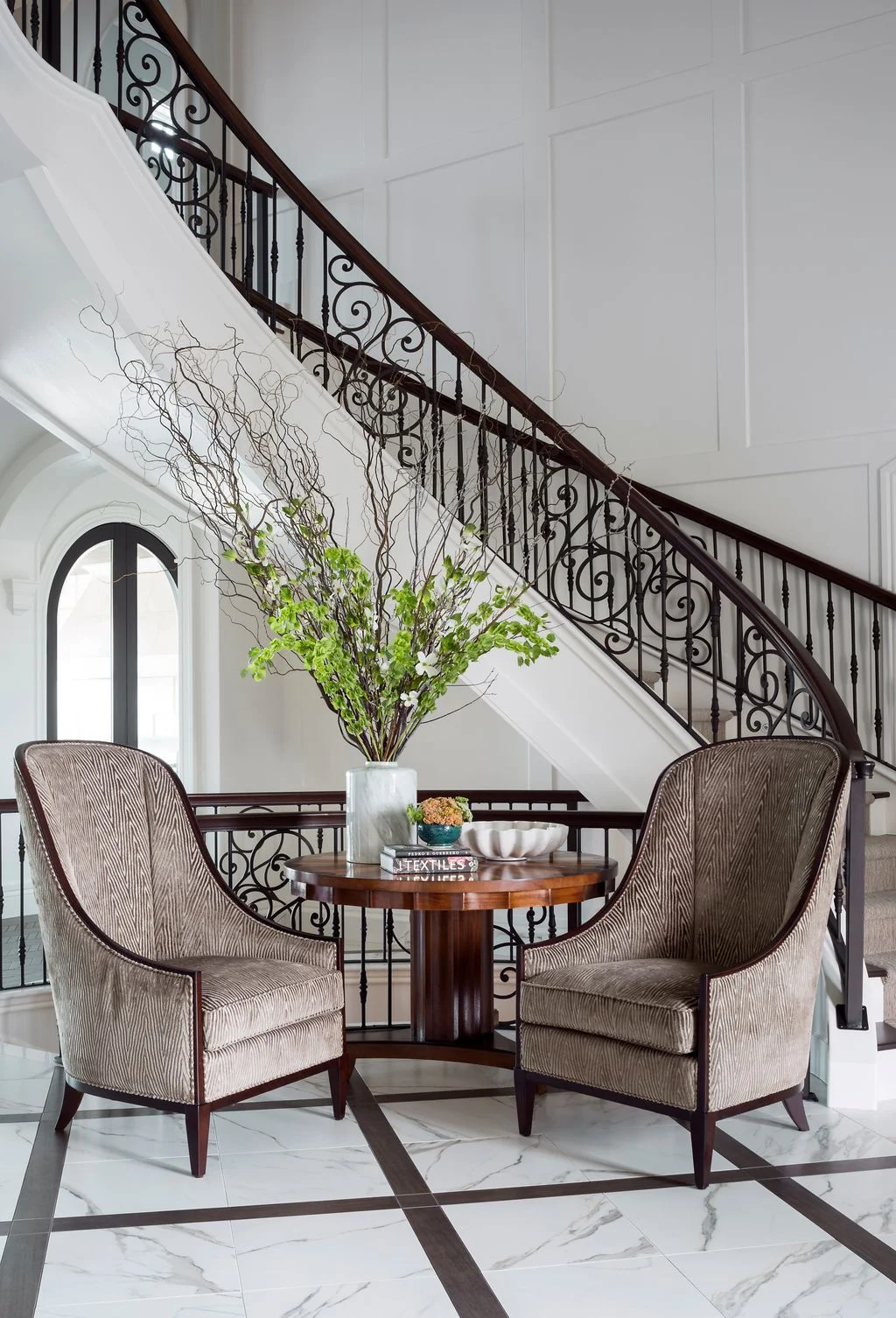 A curved staircase is one design style that works equally well in a contemporary home as it does in a traditional one....