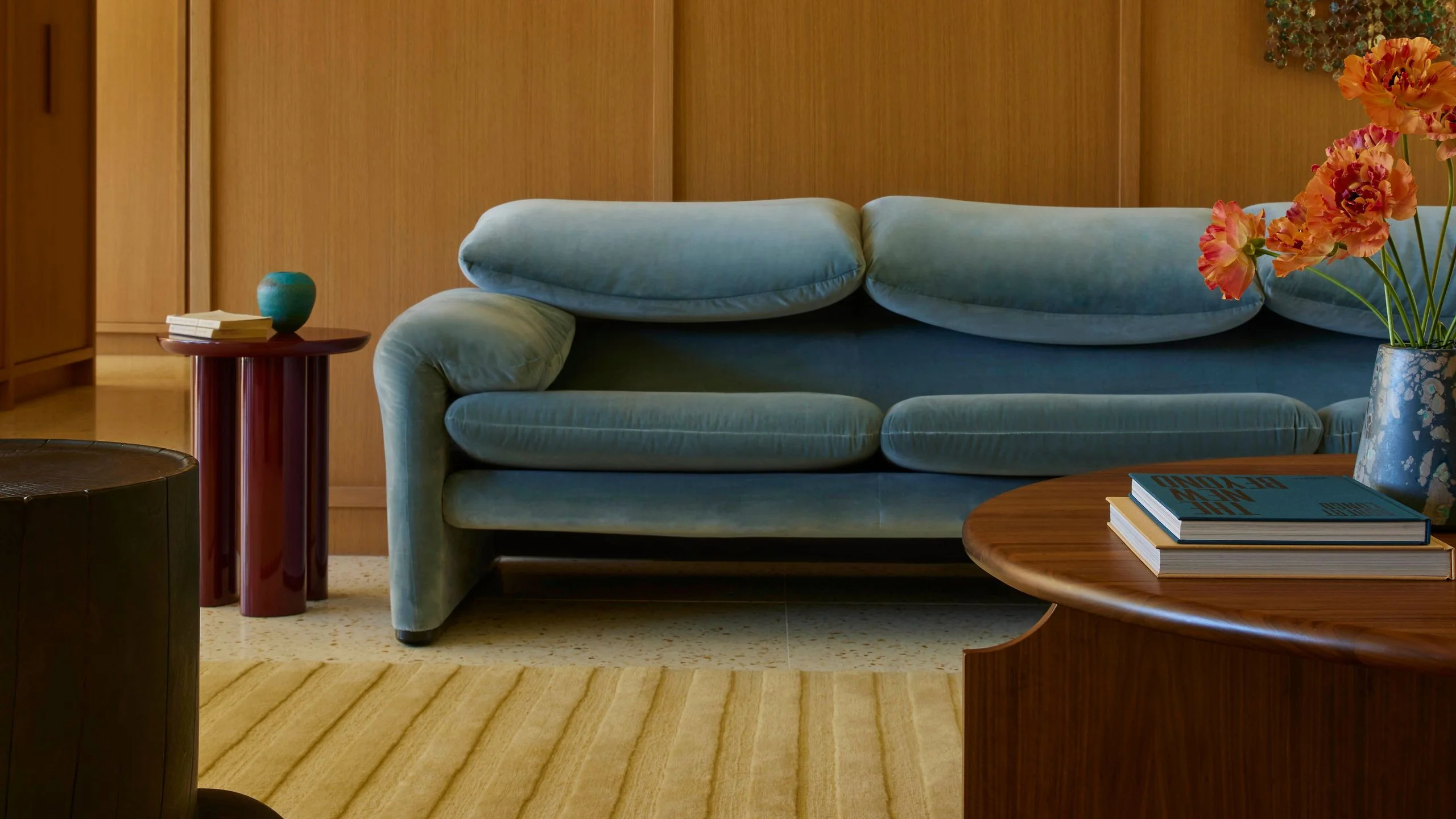 Midcentury modern livign room with blue velvet couch.