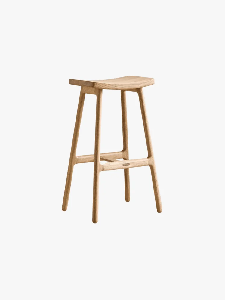 Light Oak Counter Stool with saddle style seat.