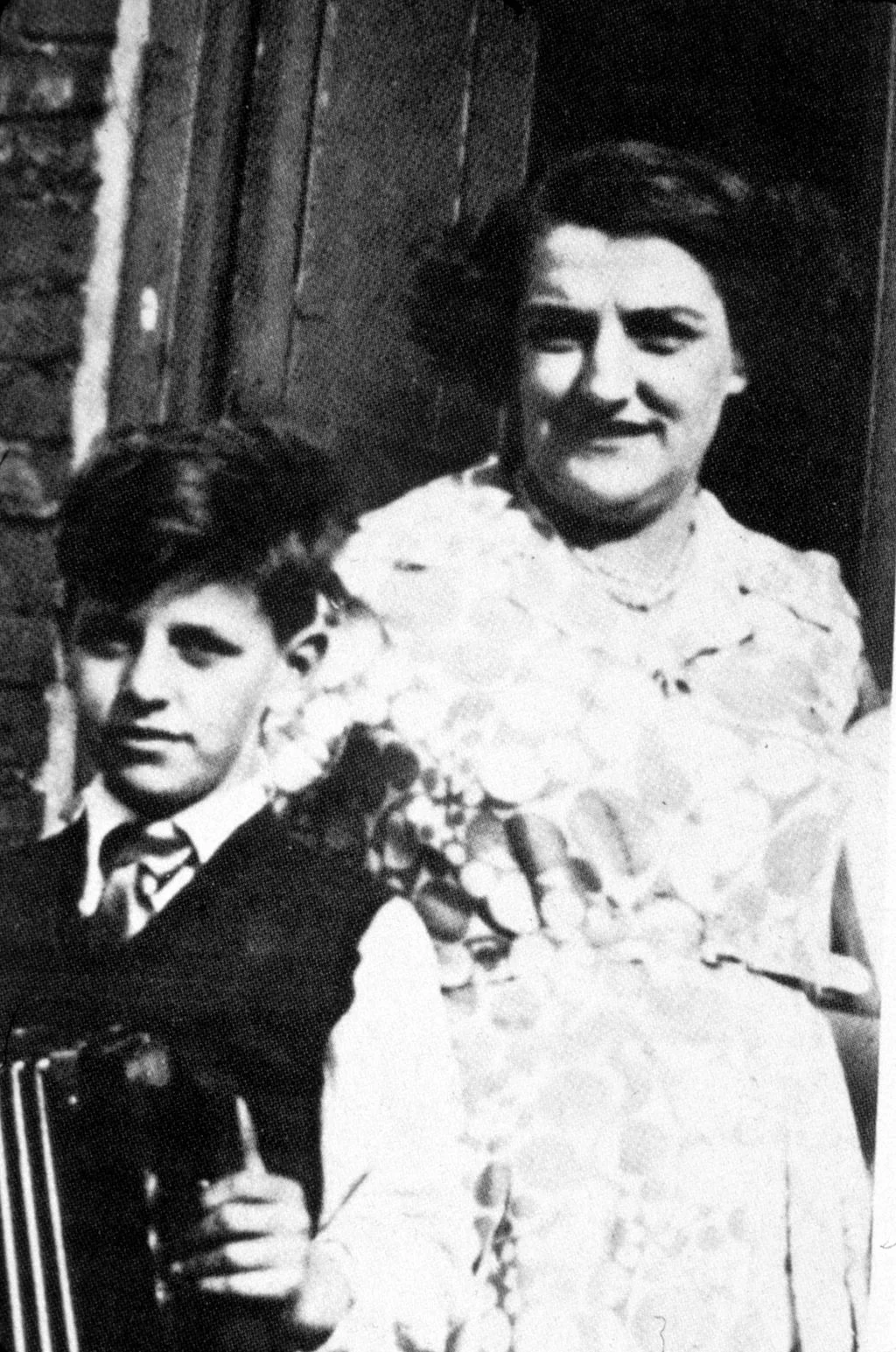 Image may contain Face Head Person Photography Portrait Formal Wear Adult Wedding Clothing Dress Suit and Fashion