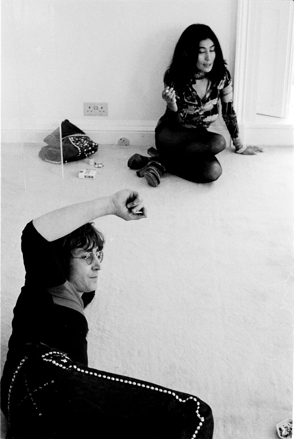 Image may contain John Lennon Yoko Ono Body Part Finger Hand Person Face Head Photography Portrait and Clothing