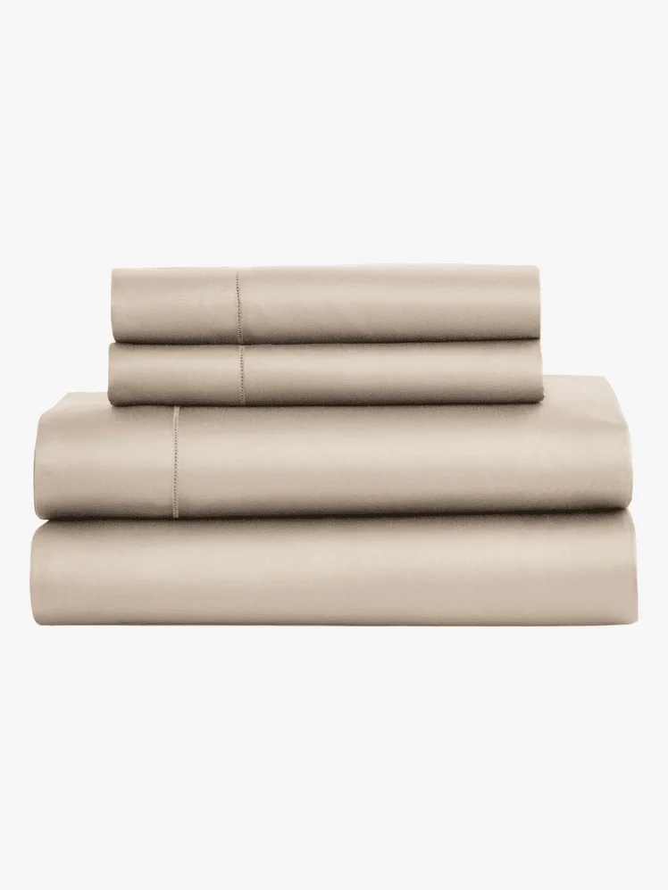 A stack of folded beige sheets 