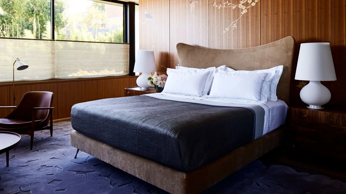 Image may contain Indoors Interior Design Lamp Chair Furniture Bed Cushion Home Decor and Wood Panels