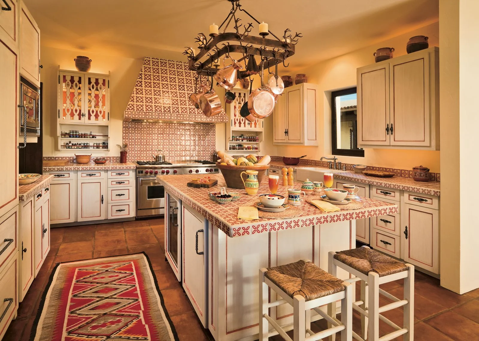 Image may contain Indoors Kitchen Interior Design Kitchen Island Chandelier Lamp and Home Decor