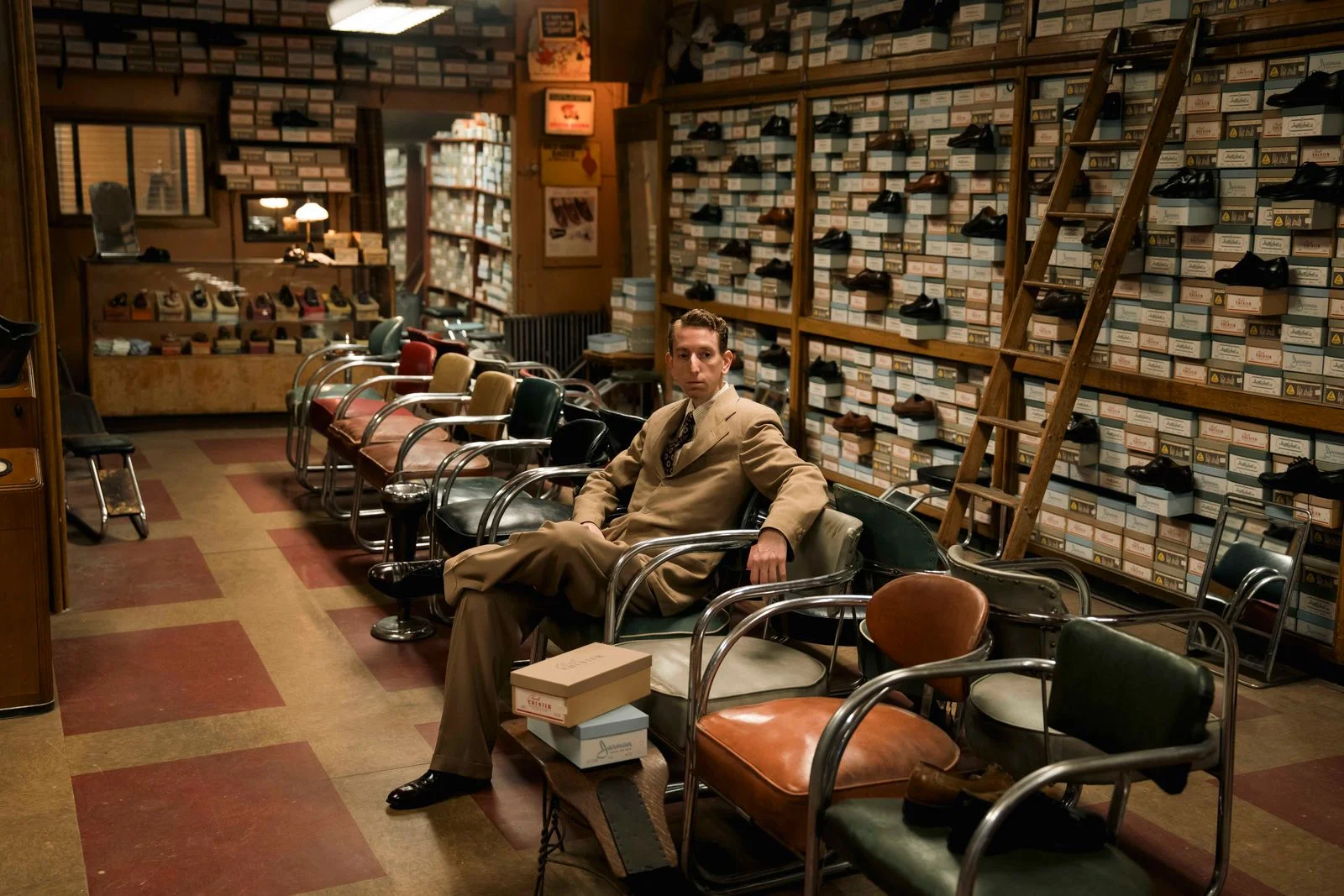 Image may contain Richard Posner Indoors Adult Person Box Accessories Formal Wear Tie Chair Furniture and Clothing