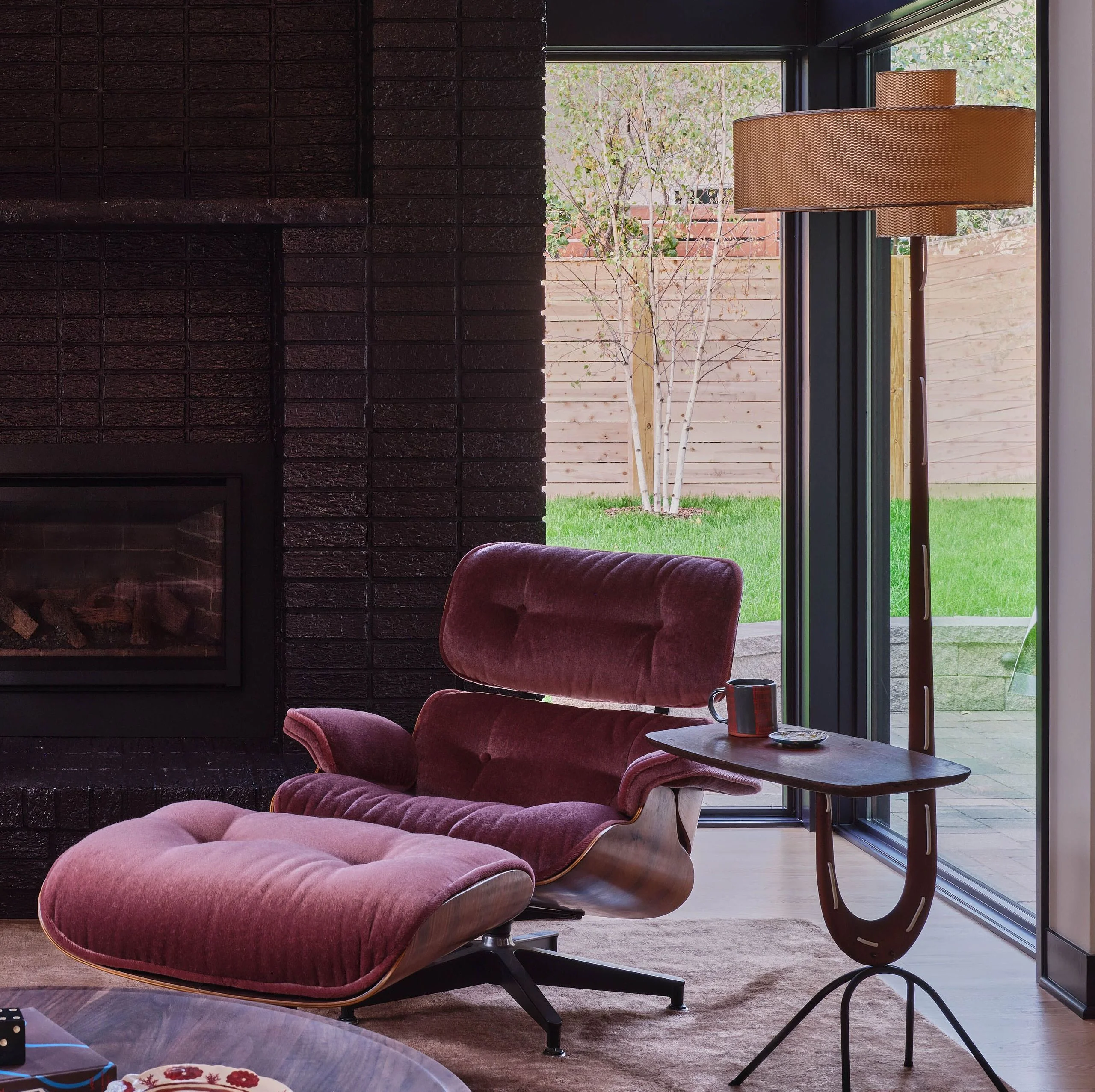 Image may contain Indoors Interior Design Fireplace Hearth Furniture Chair and Candle