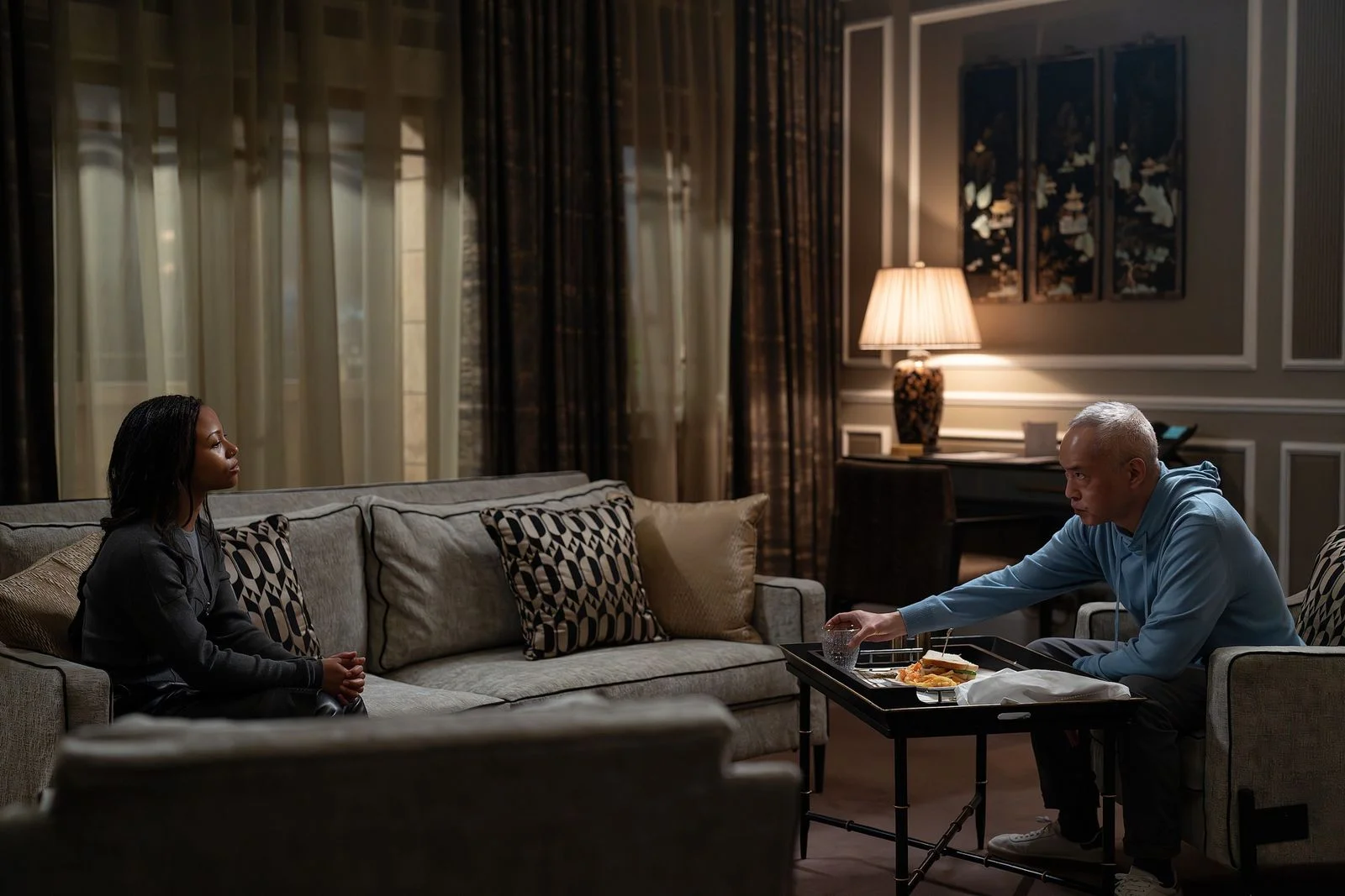 Image may contain Lamp Couch Furniture Home Decor Indoors Interior Design Cup Cushion Adult Person and Pillow