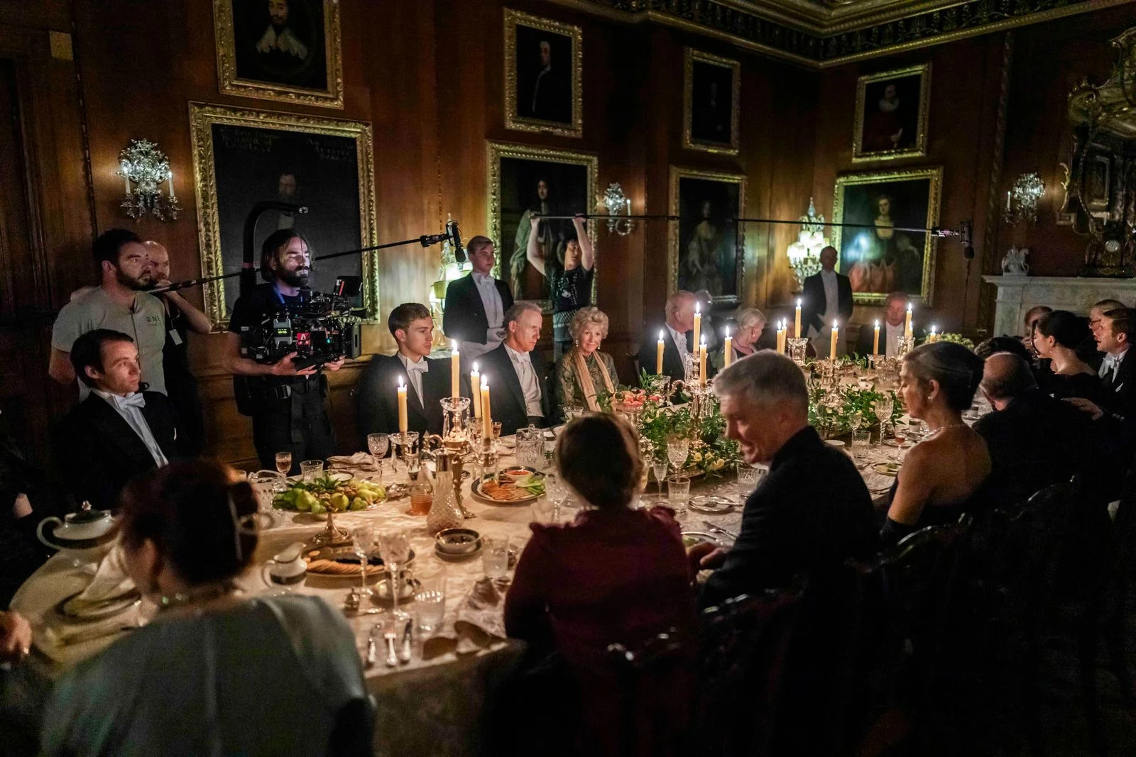 Image may contain Andrew Havill Edna Dor Adult Person Fun Indoors Hall Candle People and Electrical Device