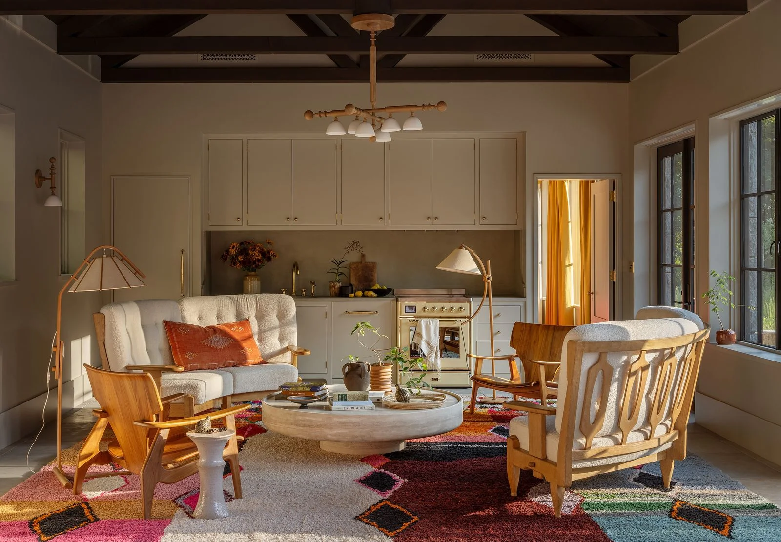 Image may contain Home Decor Indoors Interior Design Rug Furniture Table Architecture Building Living Room and Room