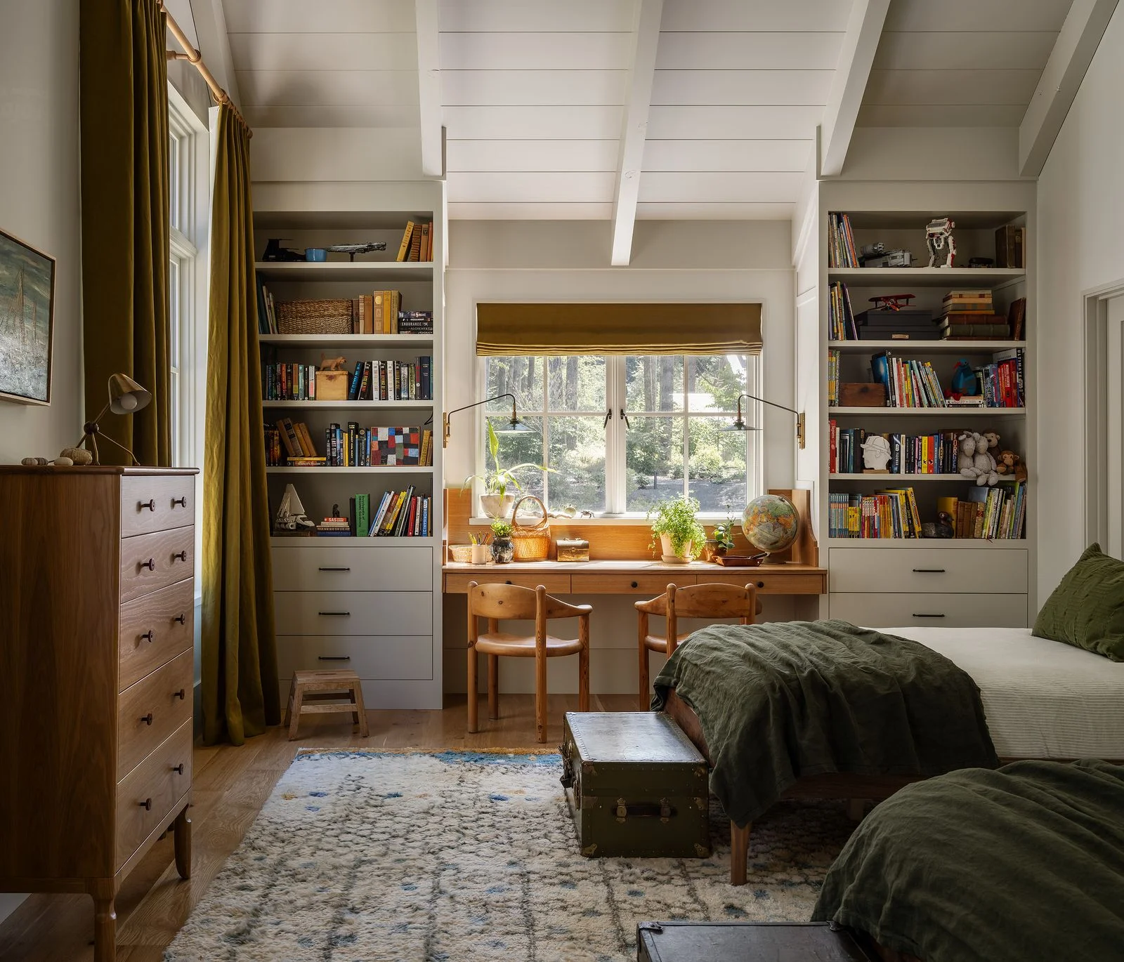 Image may contain Home Decor Furniture Indoors Interior Design Bookcase Rug Bed Bedroom and Room