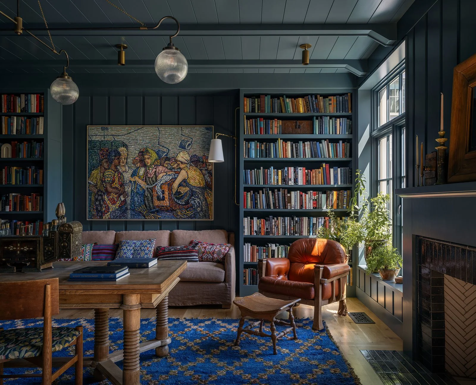 Image may contain Dontrelle Inman Sir John Tenniel Furniture Home Decor Bookcase Rug Chair Couch and Person