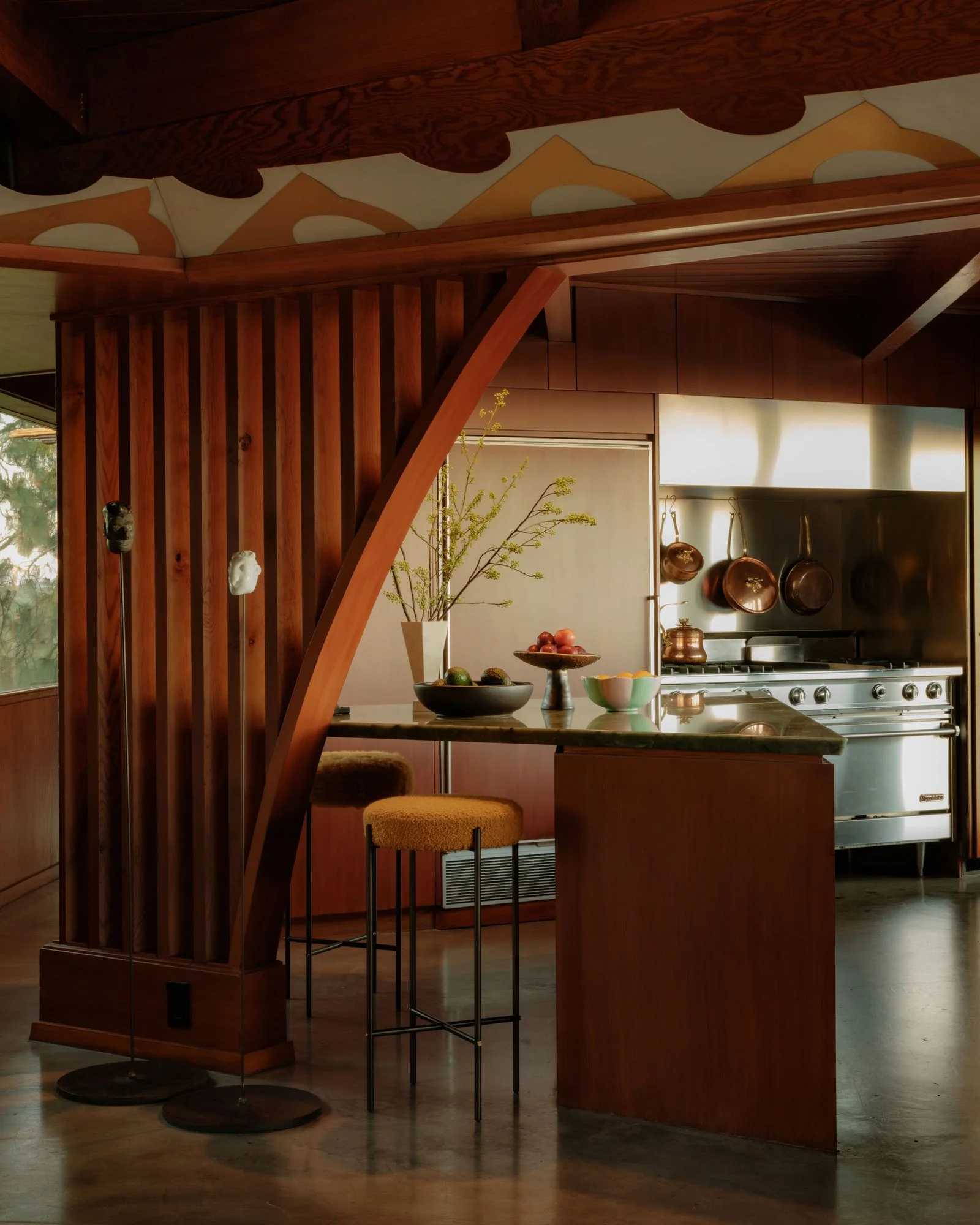 Image may contain Indoors Interior Design Kitchen Wood Hardwood Bar Stool Furniture Kitchen Island and Architecture