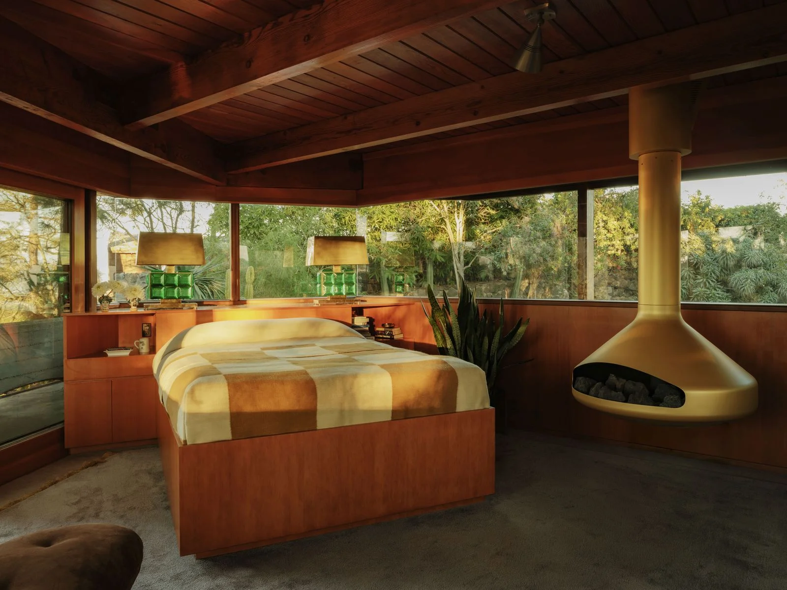 Image may contain Indoors Interior Design Architecture Building Hotel Resort Wood Bed Furniture and Hardwood