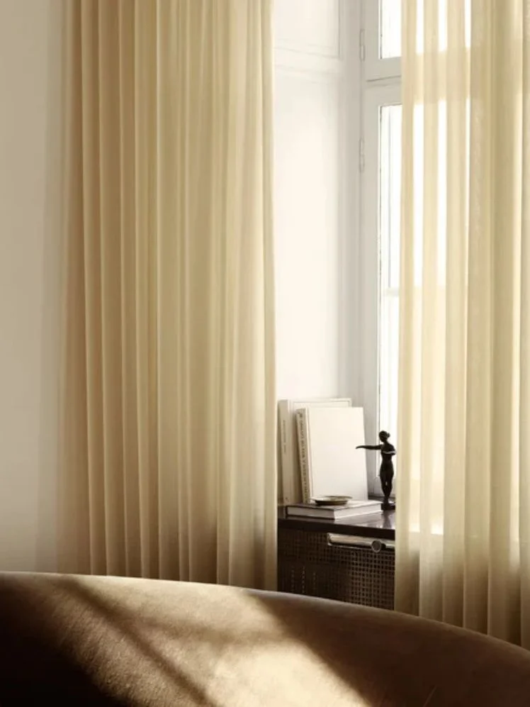 Image may contain: Indoors, Interior Design, Home Decor, Person, Window, Cushion, and Pillow