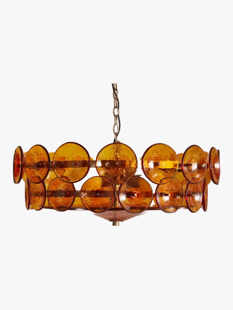 Image may contain: Chandelier, Lamp, Accessories, and Jewelry