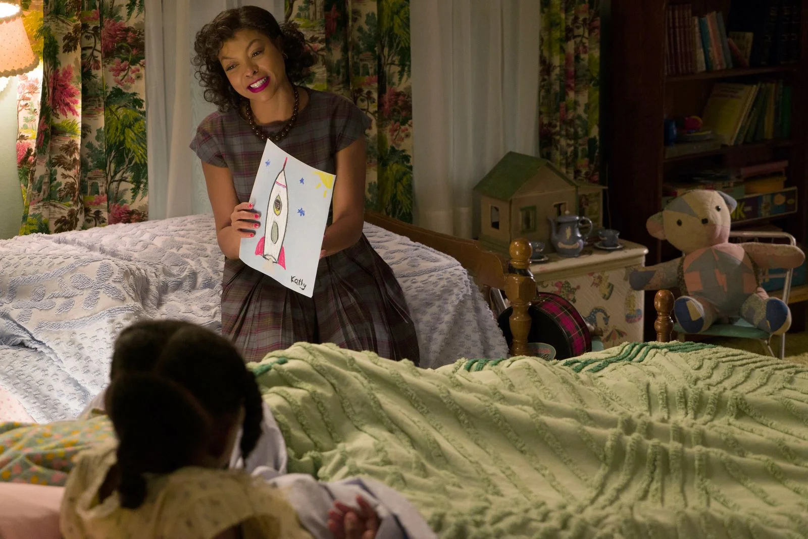 Image may contain Taraji P. Henson Furniture Adult Person Couch Accessories Jewelry Necklace Baby Bed and Bedroom