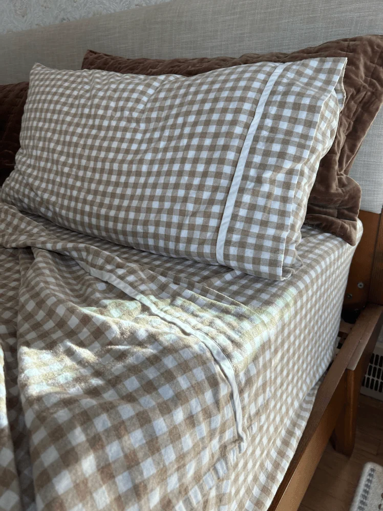 Image may contain: Cushion, Home Decor, Pillow, Bed, Furniture, and Couch