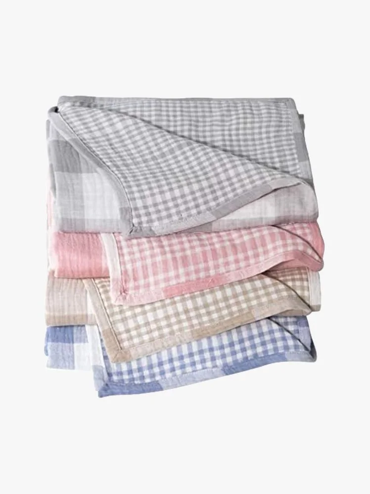 Image may contain: Home Decor, Linen, Blanket, and Diaper