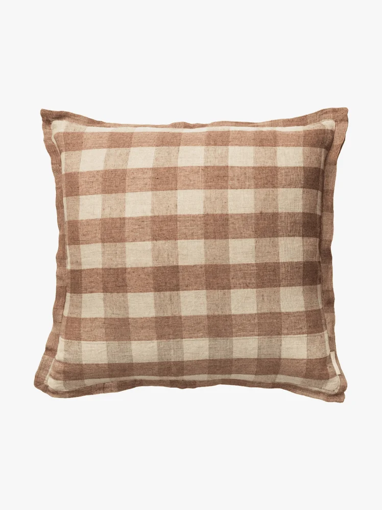 Image may contain: Cushion, Home Decor, Pillow, Clothing, and Skirt