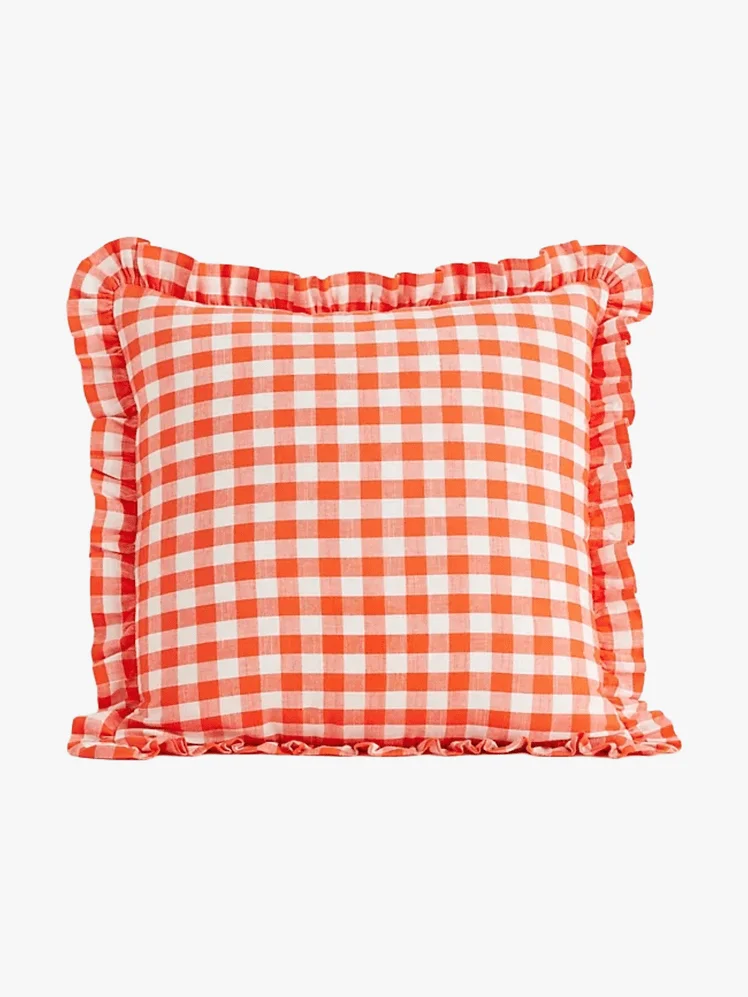 Image may contain: Cushion, Home Decor, Pillow, Blouse, and Clothing