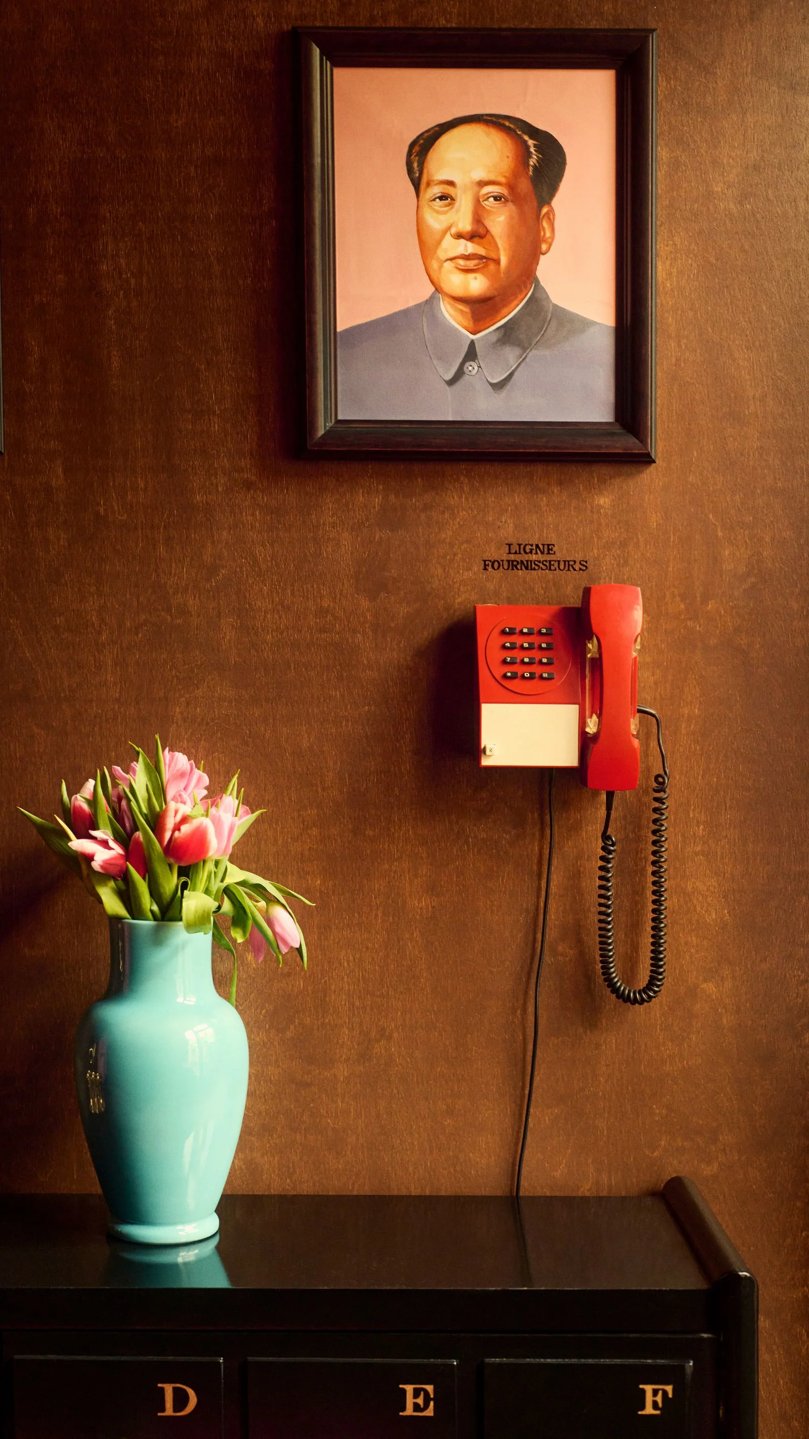 Image may contain Mao Zedong Flower Flower Arrangement Plant Adult Person Electronics Phone Face and Head