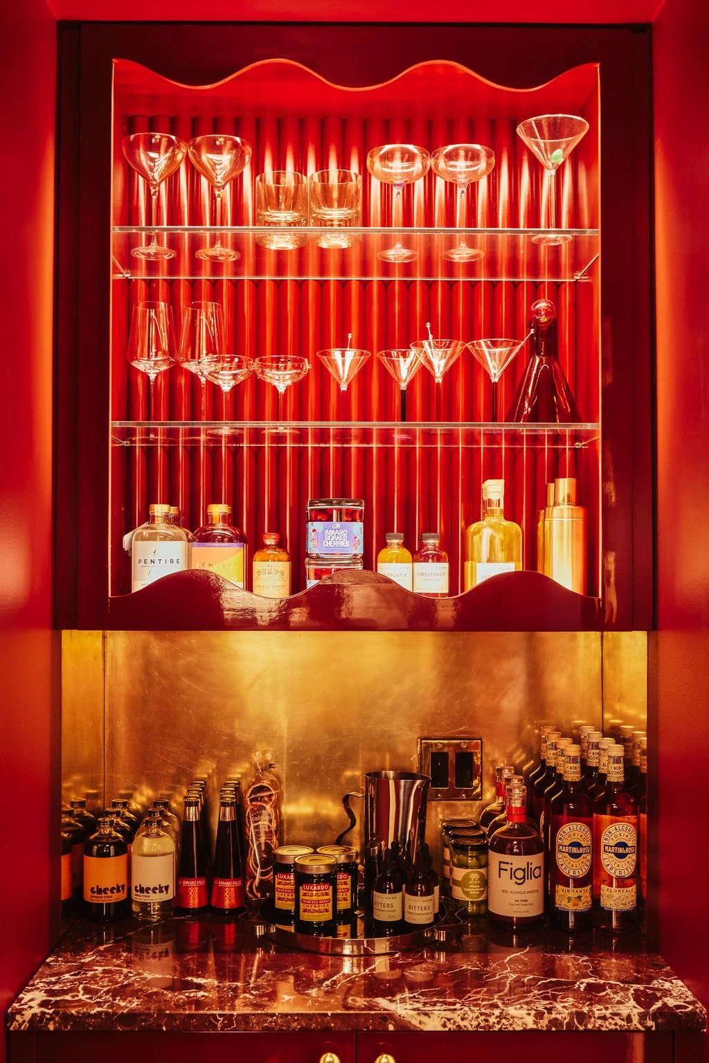 Image may contain Alcohol Beverage Liquor Bottle Cosmetics Perfume Furniture Beer Shelf and Wine