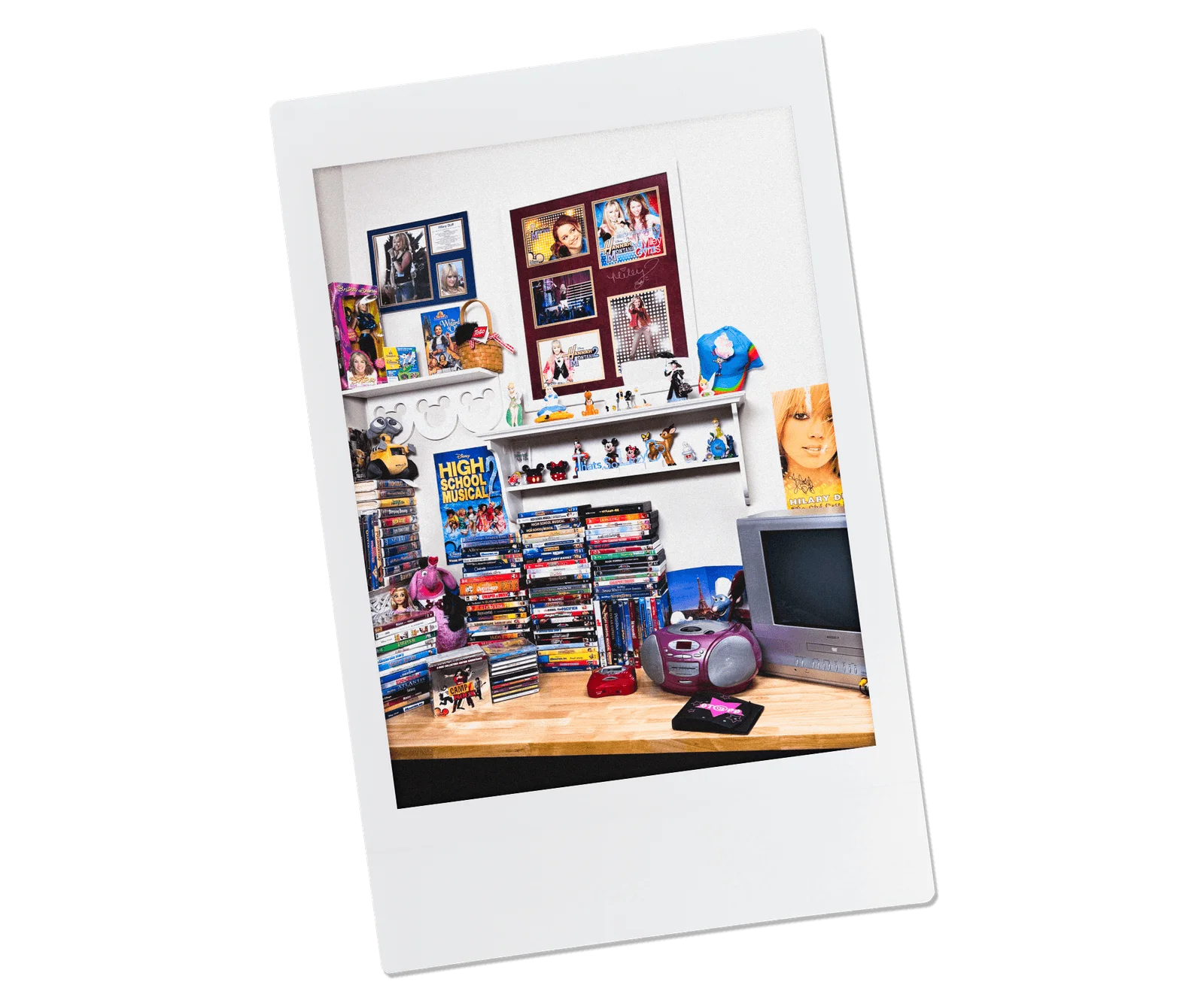 Image may contain Hilary Duff Electronics Screen Computer Hardware Hardware Monitor Shelf Furniture Table and TV