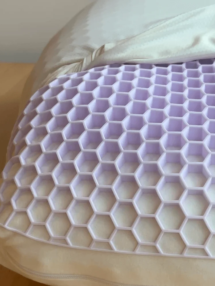 Hexagonal purple foam grid on a pillow.