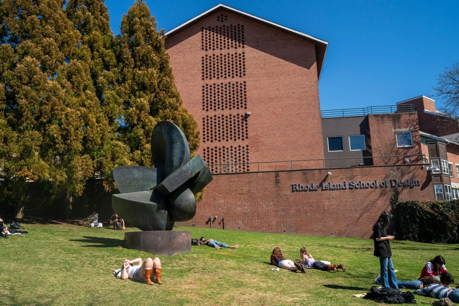 Image may contain Grass Plant Person Architecture Building College Clothing Footwear and Shoe