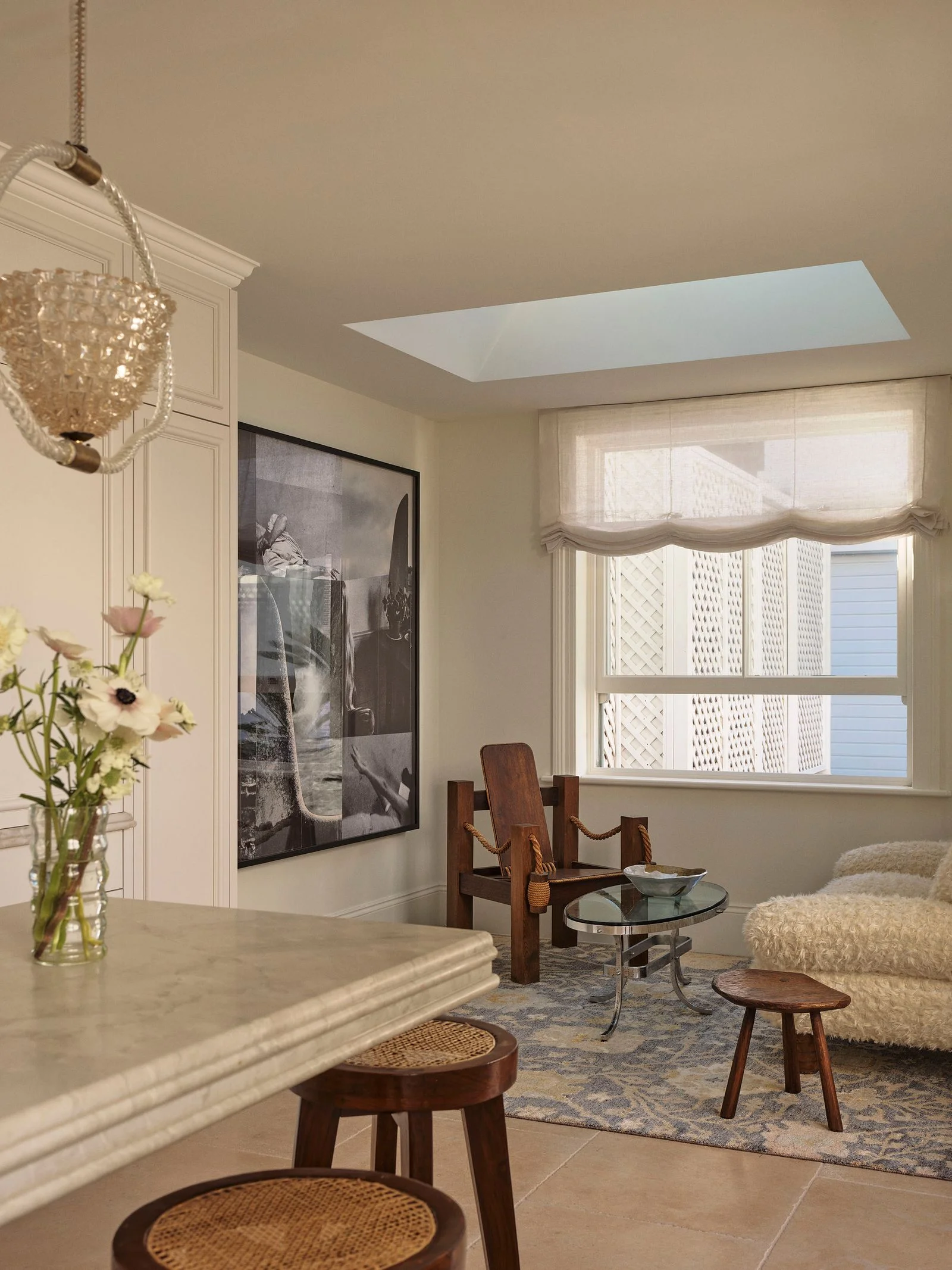 Image may contain Chair Furniture Home Decor Window Dining Table Table Chandelier Lamp Floor and Rug