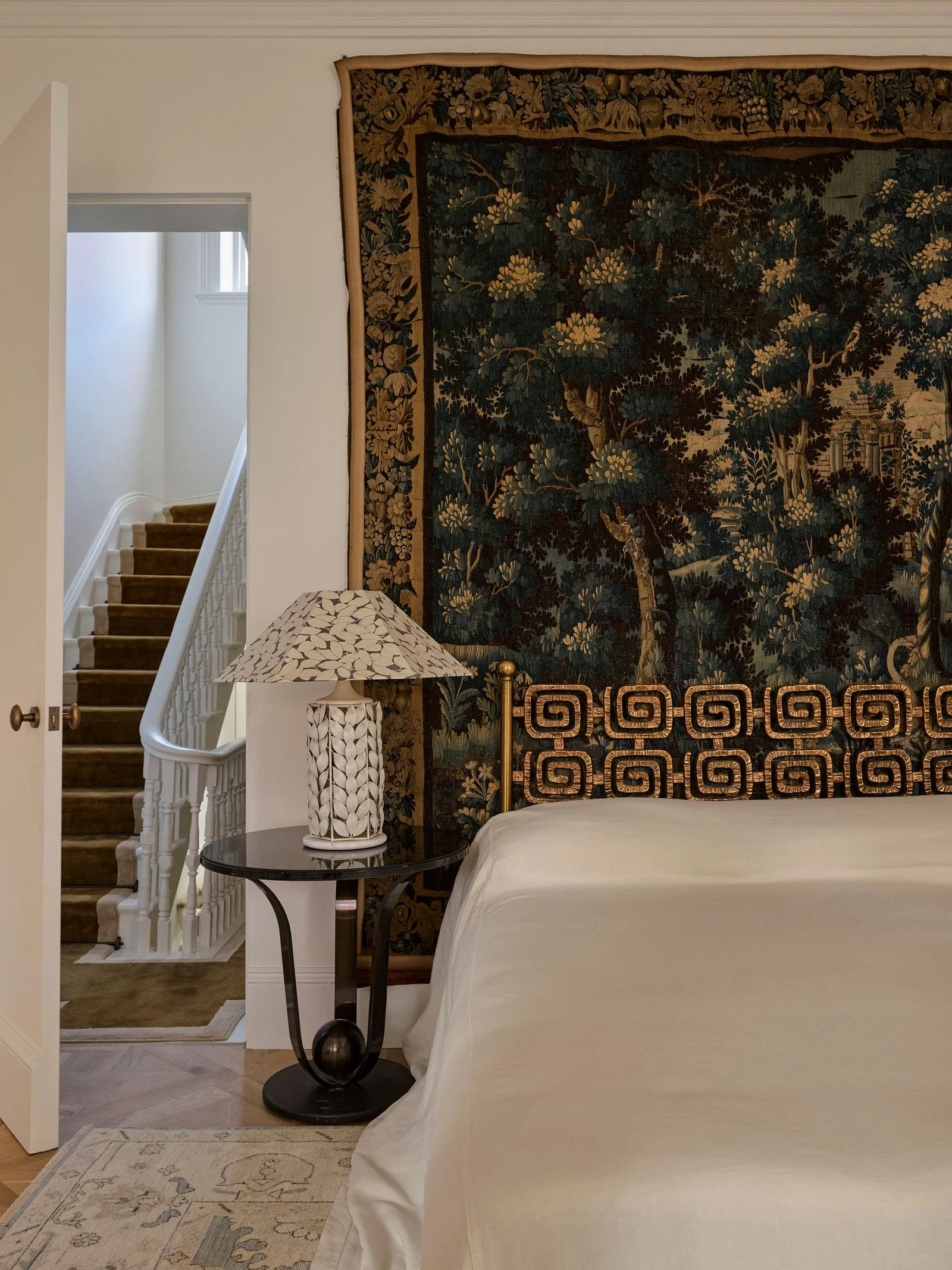 Image may contain Home Decor Accessories Art Ornament Tapestry Rug Lamp Indoors Interior Design and Architecture