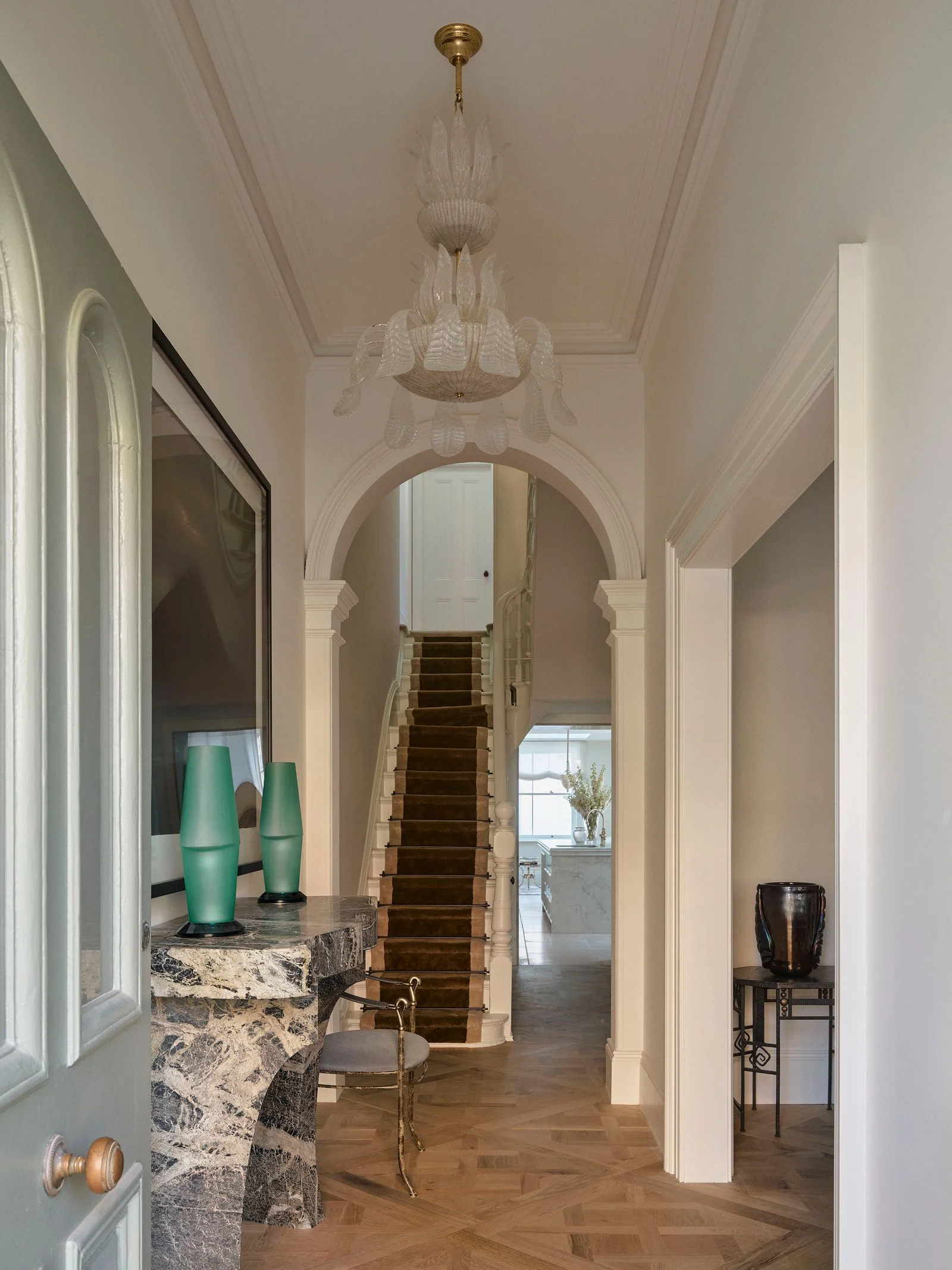 Image may contain Indoors Architecture Building Foyer Chair Furniture Chandelier and Lamp