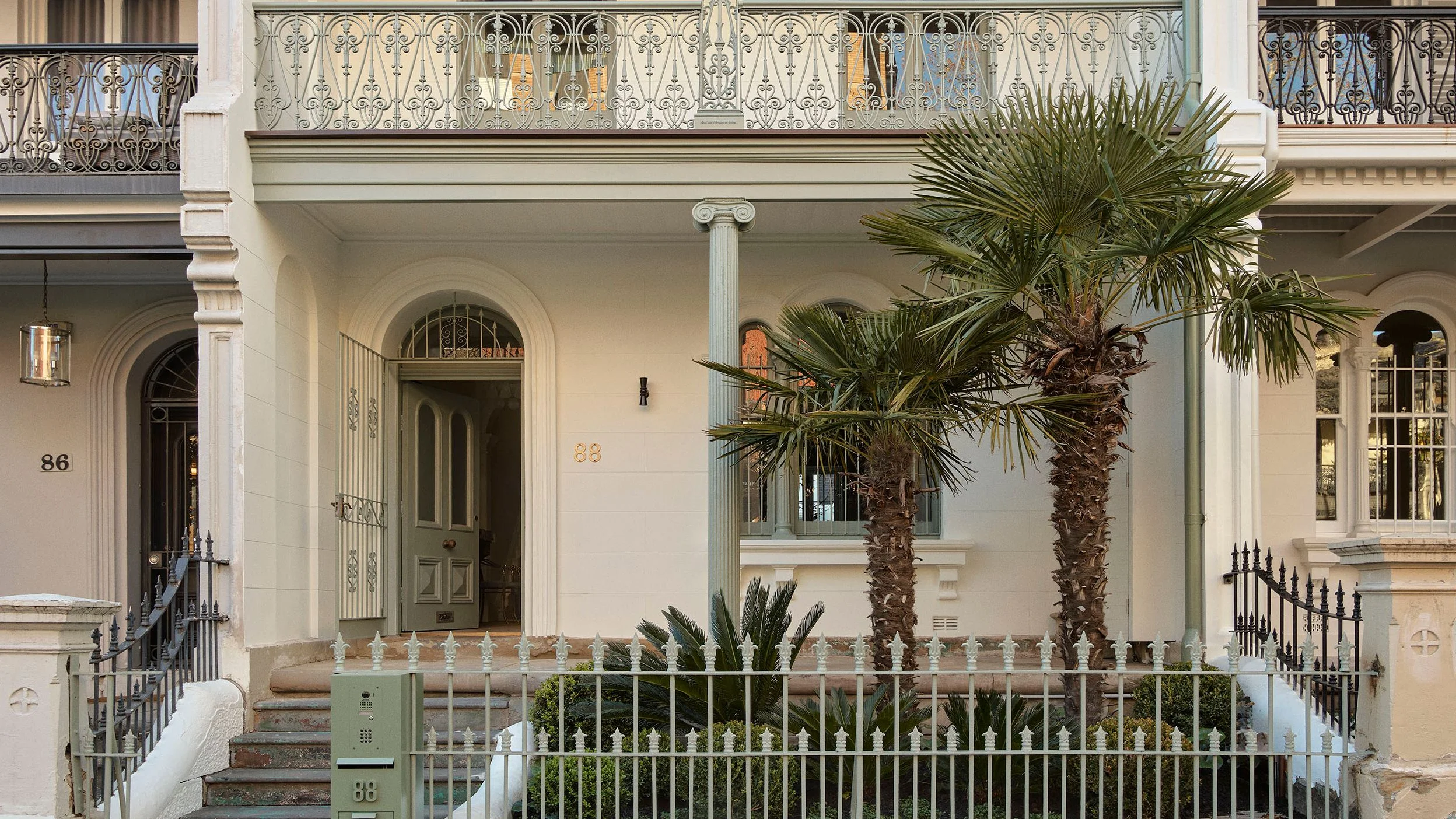 Image may contain Architecture Building Housing Lamp House Portico and Row House