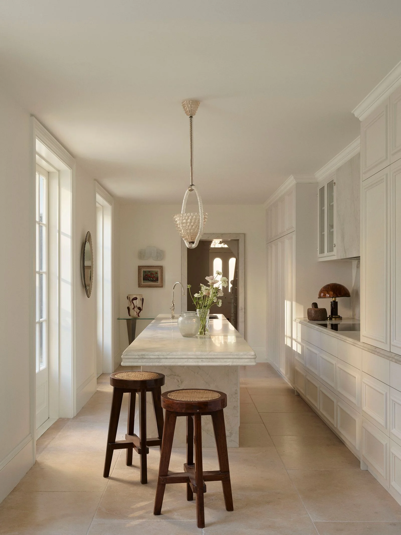 Image may contain Architecture Building Dining Room Dining Table Furniture Indoors Room Table Lamp and Corner