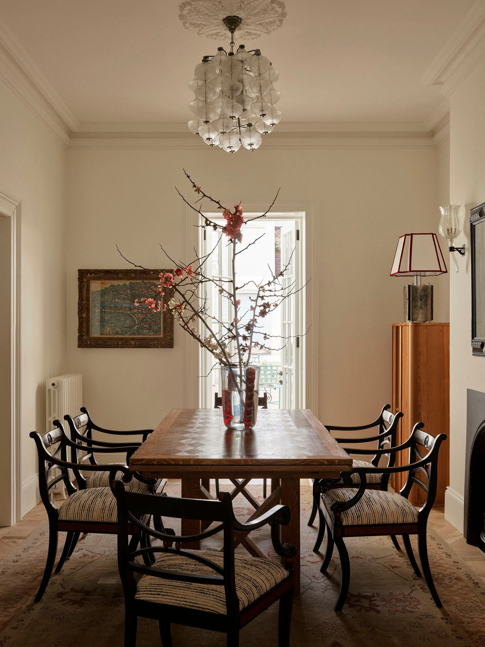 Image may contain Architecture Building Dining Room Dining Table Furniture Indoors Room Table Chandelier and Lamp