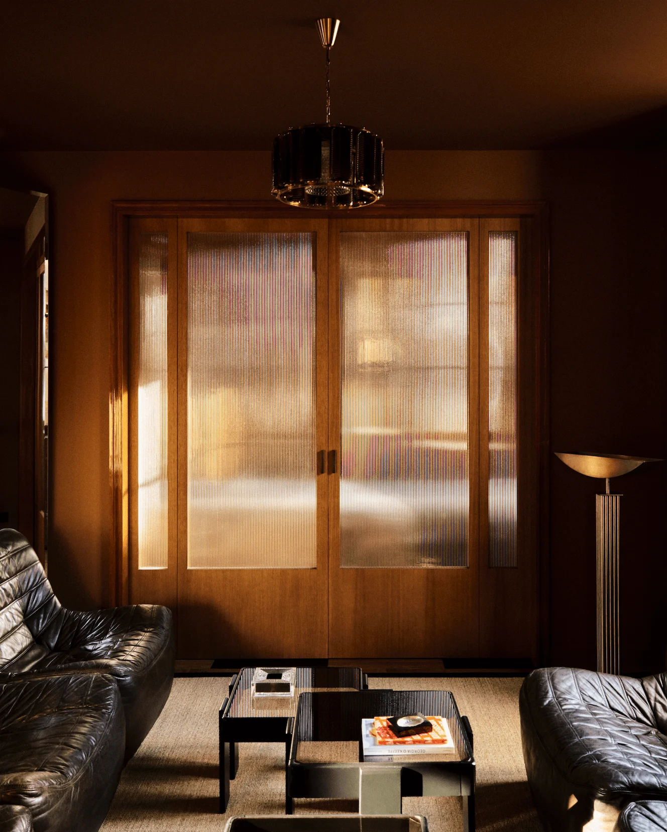 Image may contain Architecture Building Furniture Indoors Living Room Room Couch Interior Design and Door