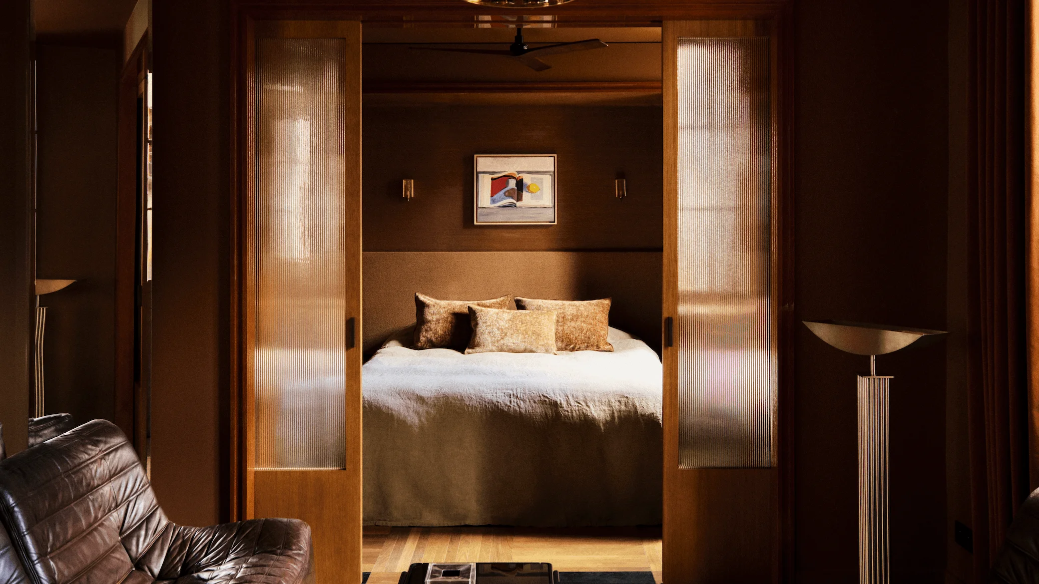 Image may contain Indoors Interior Design Furniture Bed Bedroom Room Wood Floor Flooring and Home Decor