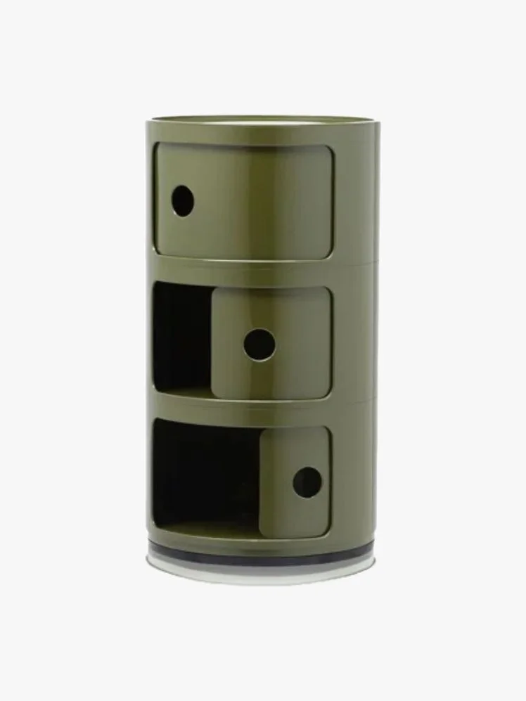 Cylindrical green side table with 3 sliding door compartments.