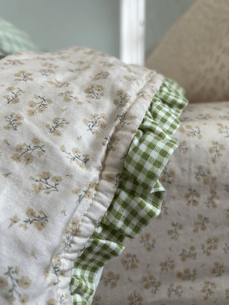 Image may contain: Clothing, Hat, Bonnet, Baby, Person, Home Decor, and Linen