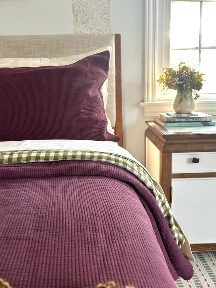 Plum ribbed duvet cover on a bed.