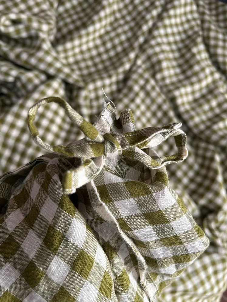 Linen gingham duvet cover tied into a bow.